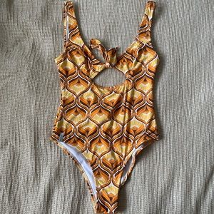On piece bathing suit by Rhythm swim
